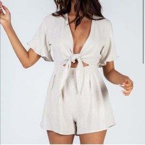Cute neutral romper with tie front!